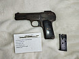 znehodnocená pistole FN 1900