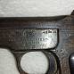 znehodnocená pistole FN 1900